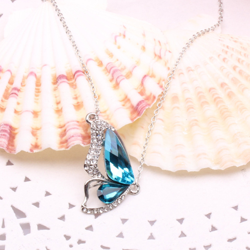 A supply of blue crystal gem butterfly collarbone chain
