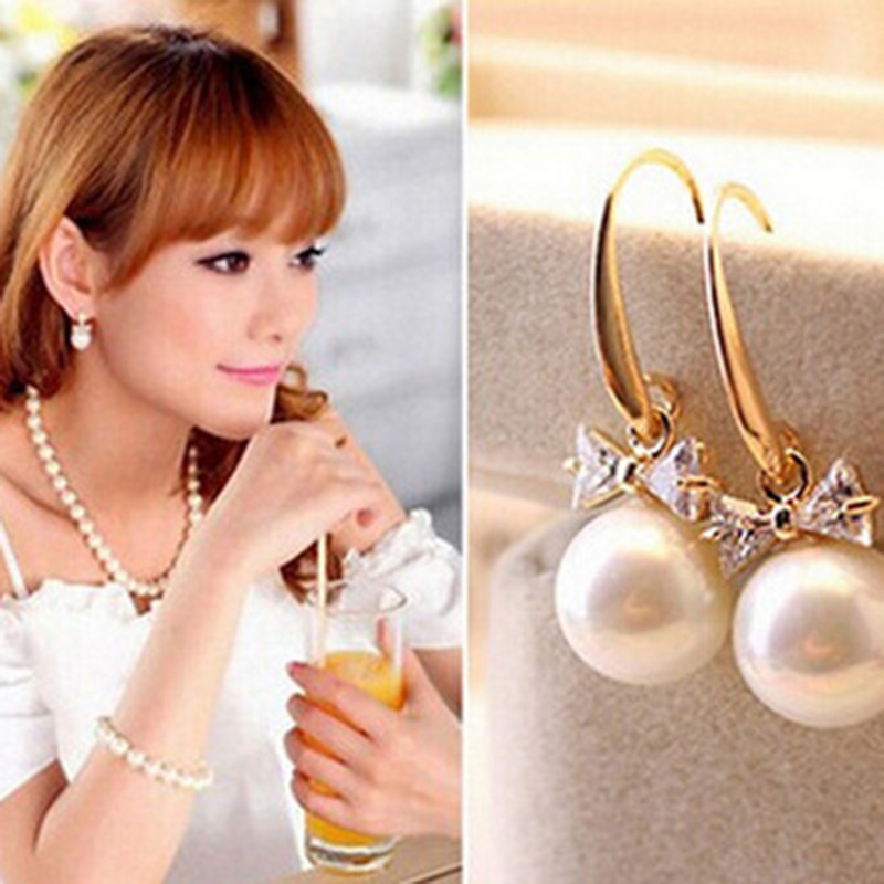 Simple lady tide with Korean version of fashion flash diamond bow large pearl ear nails Korea jewelry wholesale and direct sales
